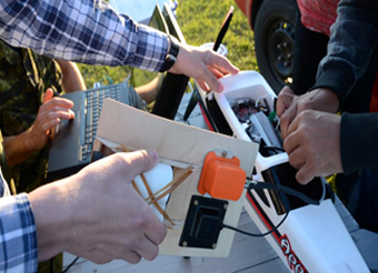 Figure 6 shows the Bluejay hardware being installed in a miniature remote-controlled airplane. End Figure 6.