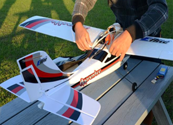 Figure 7 shows the remote-controlled airplane receiving some final adjustments just prior to takeoff. End Figure 7.