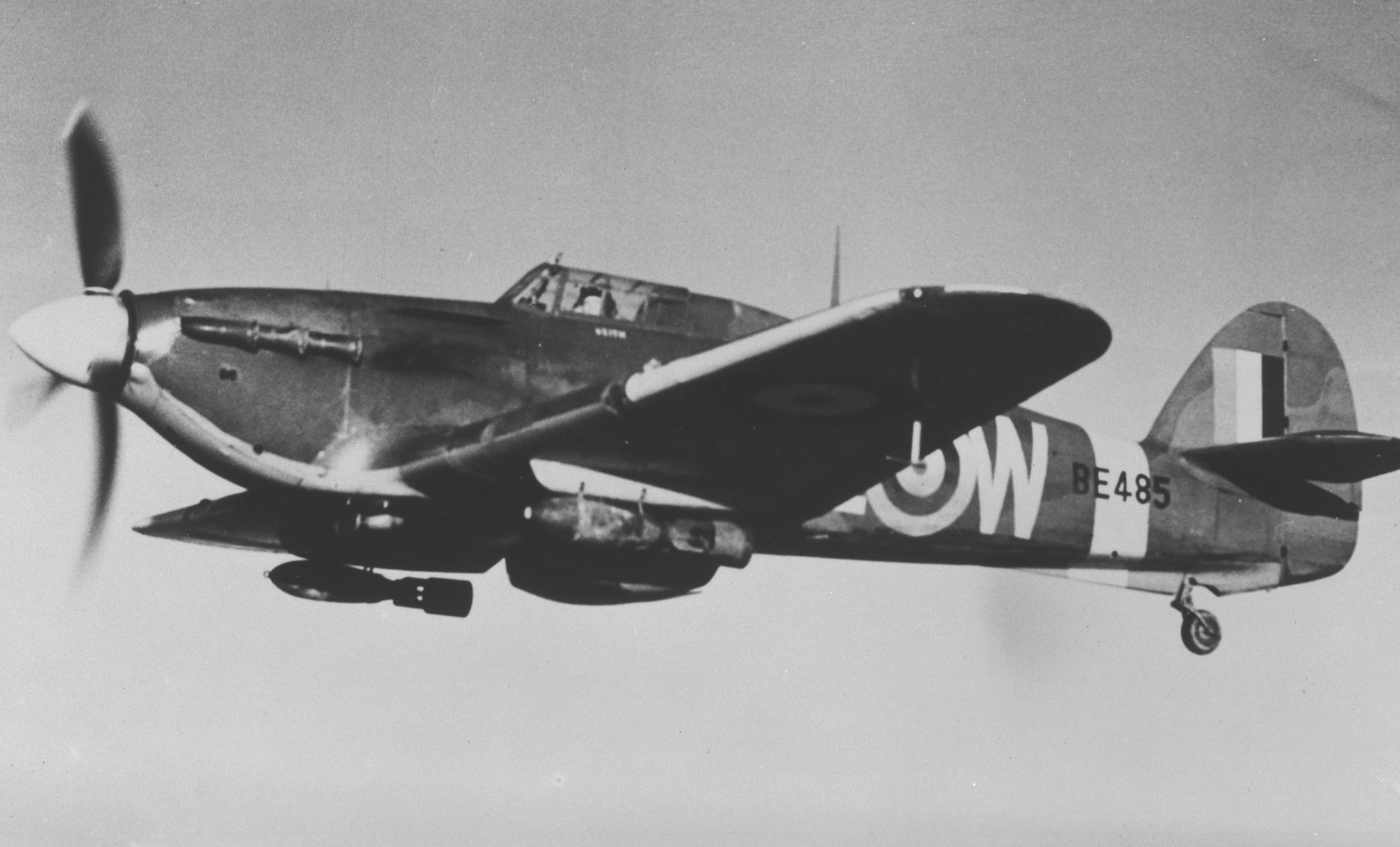 A Hawker Hurricane Mk IIB from 402 (Fighter) Squadron crosses the English Channel on an intruder sortie into occupied France in 1941. It carries 250 pound bombs slung under its wings PHOTO: DND Archives, PL-6897