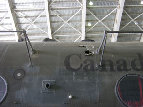 Damage to the fuselage left side and to the HF antennae