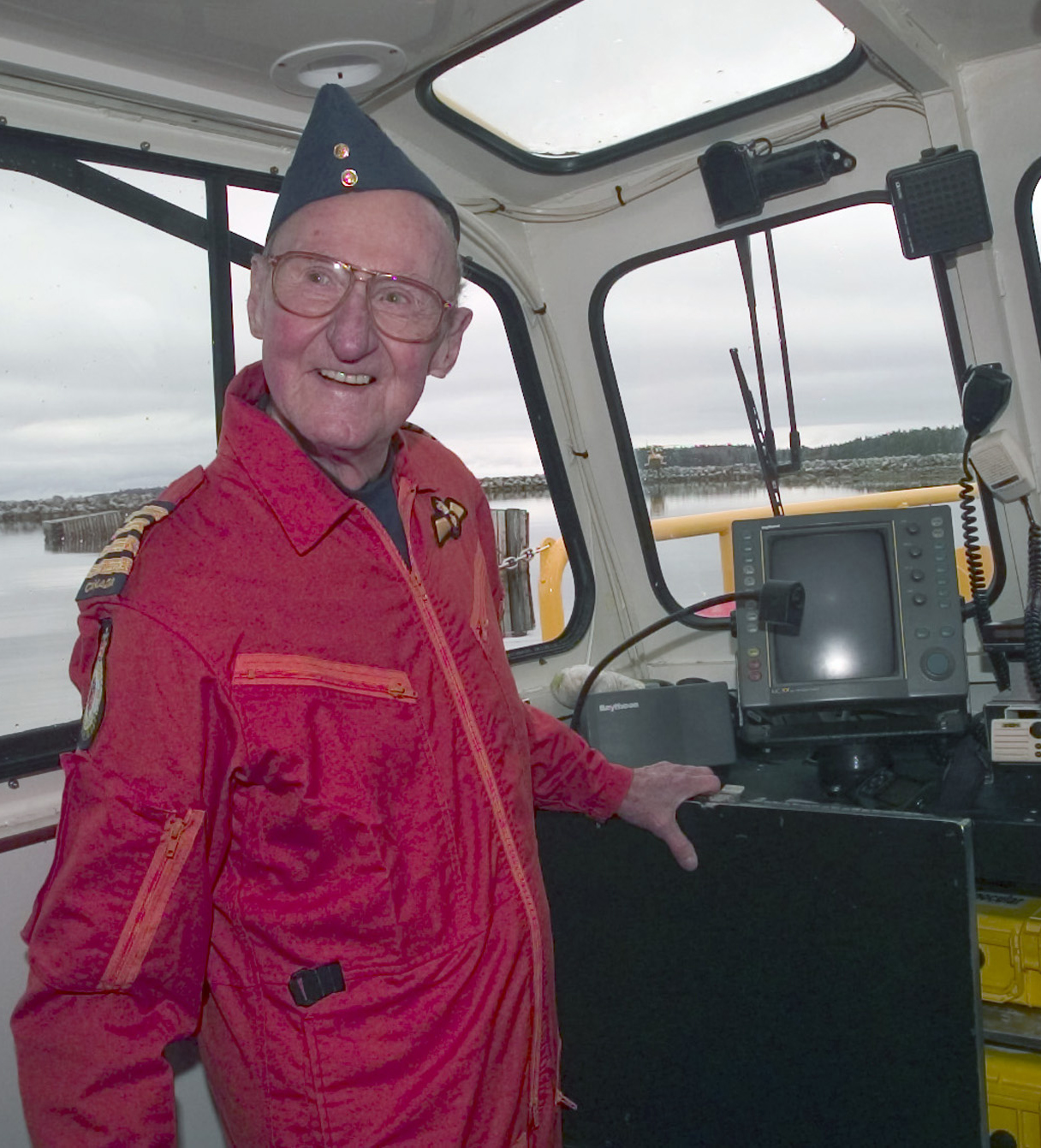 In a photo from May 2003, Air Marshall Len Birchall, honorary colonel of 413 Squadron, located at Greenwood, Nova Scotia, is aboard a new search and rescue training boat that he had just christened as the "Saviour of Ceylon". PHOTO: GD2003-0329-011d 