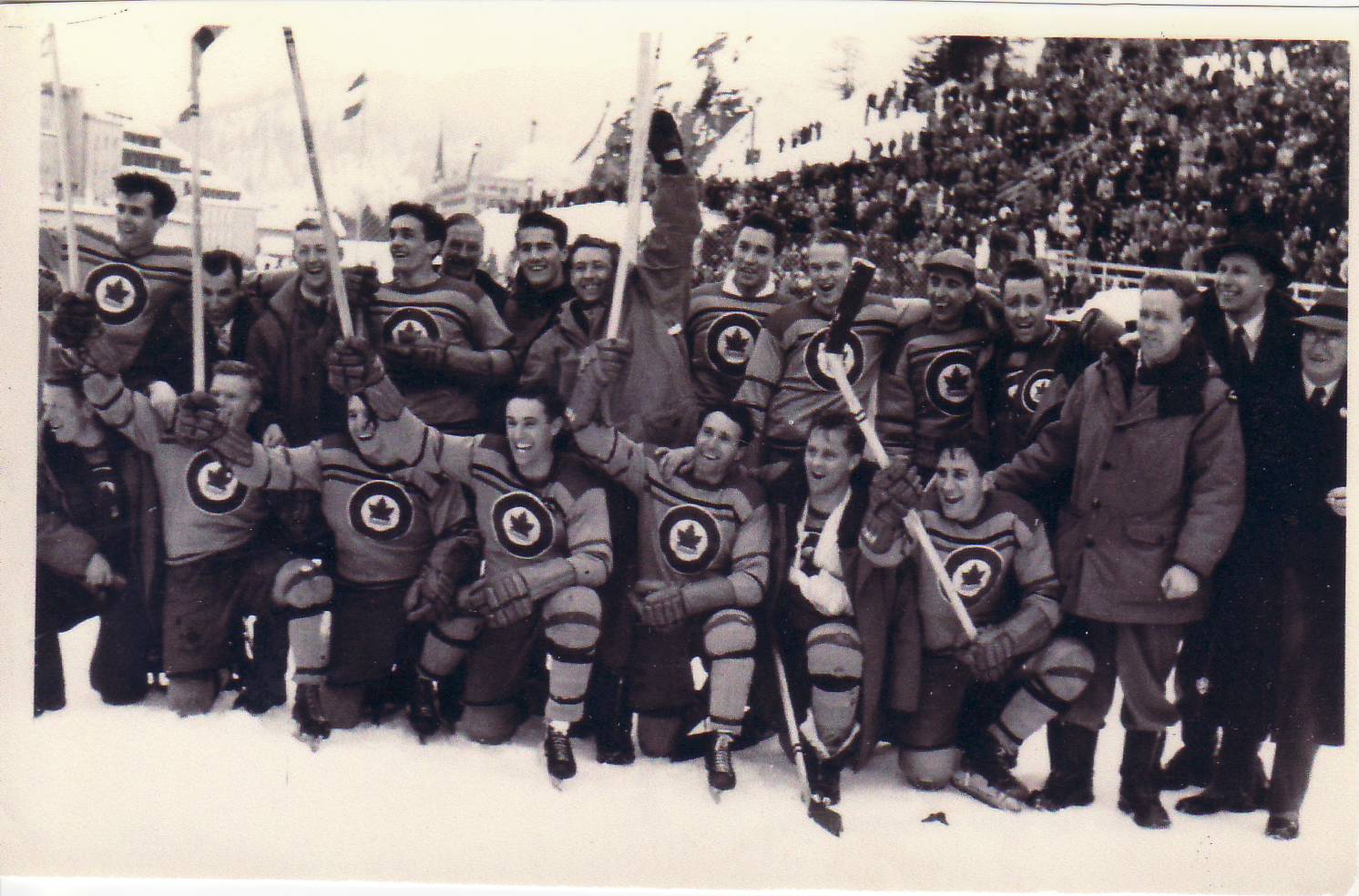 The RCAF Flyers celebrate their Gold Medal win over Switzerland on the outdoor rink at St. Moritz in 1948.