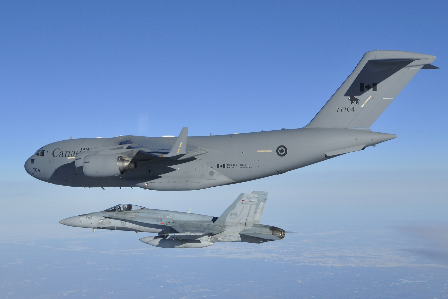 A CC-177 Globemaster III from 429 Transport Squadron, piloted by Captain Capt Dave Hicks, arrives in Ottawa on March 18, 2014. The last Canadian troops to leave Afghanistan were onboard the historic flight. The Globemaster was escorted by two CF-18 Hornet fighter jets from 425 Tactical Fighter Squadron, 3 Wing Bagotville, Quebec. PHOTO: DND
