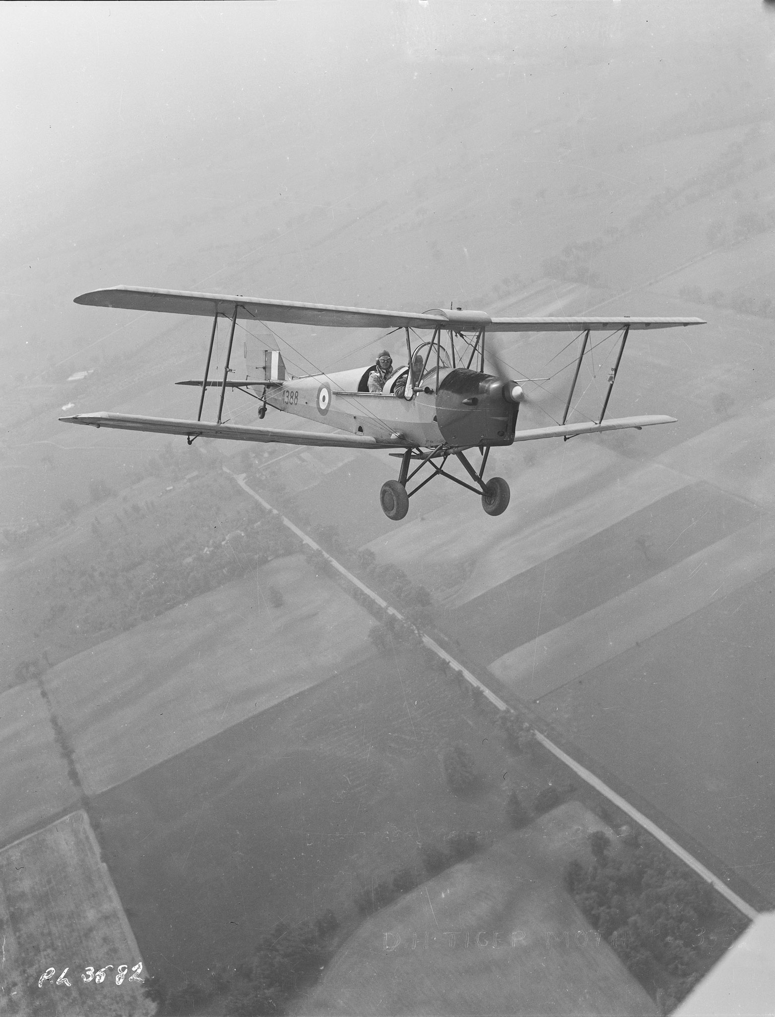 A Tiger Moth flies out of No. 1 Elementary Flight Training School at RCAF Malton, Ontario. Almost all of the pilots under the British Commonwealth Air Training Plan in Canada began their flight training on Tiger Moths. PHOTO: DND Archives, PL-3582