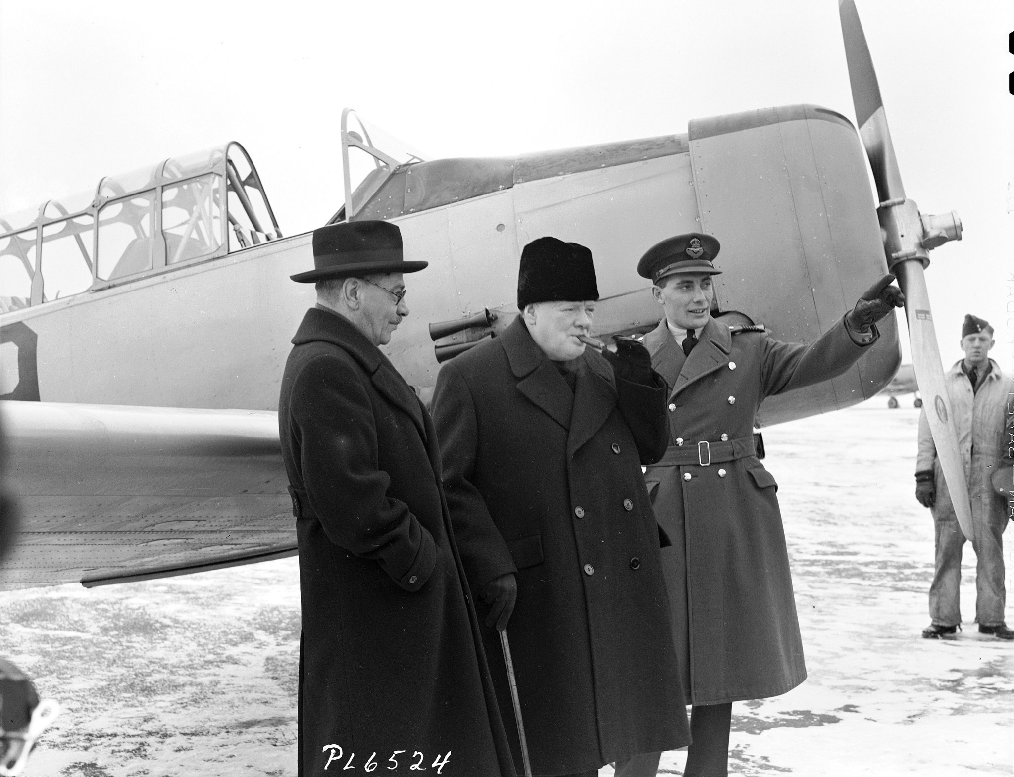British Prime Minister Winston Churchill (centre) visits the British Commonwealth Air Training Plan school at RCAF Uplands, Ontario, in December 1941 with Canadian Air Minister C.G. Power (left) and Wing Commander W.R. MacBrien. PHOTO: DND Archives