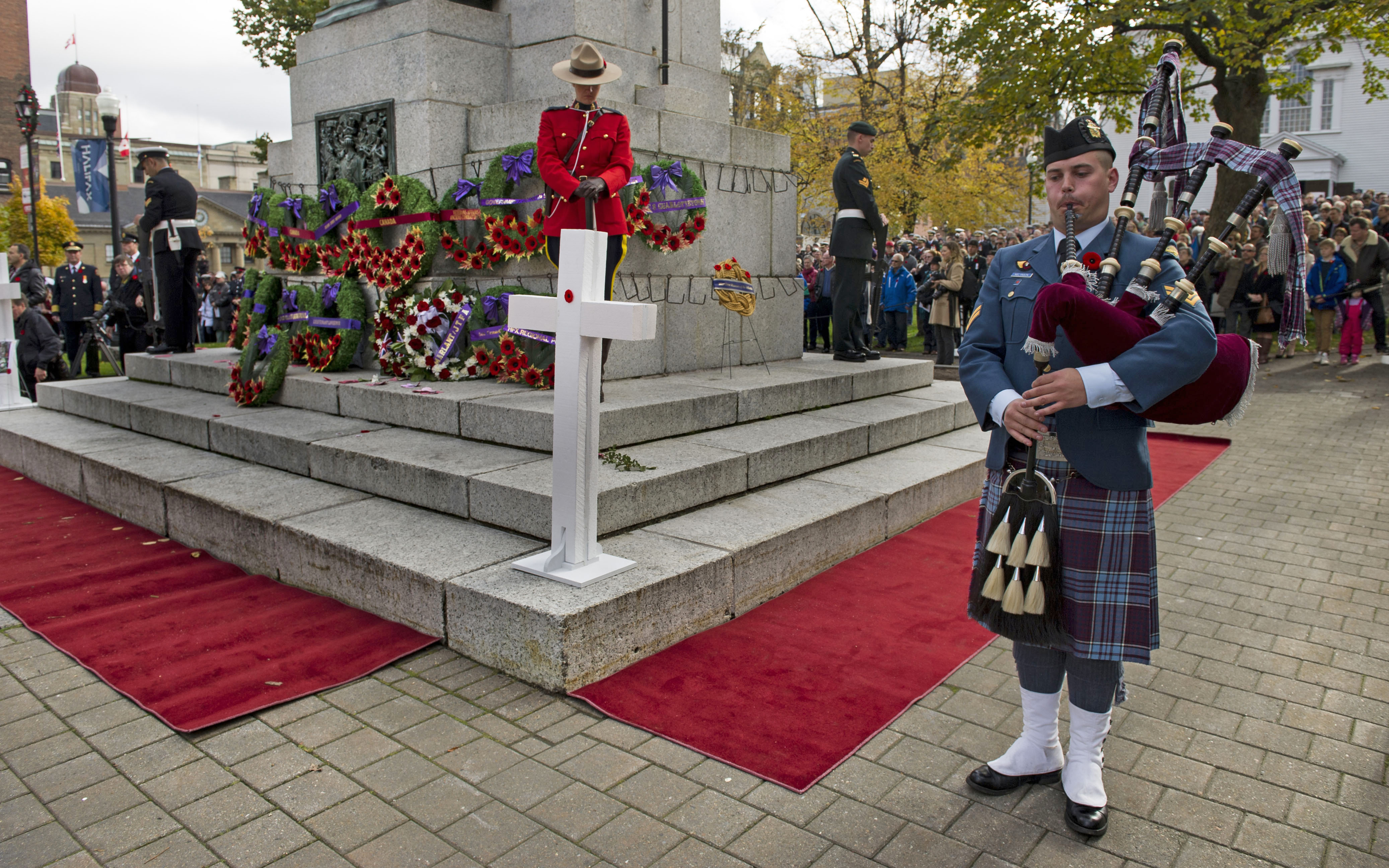 Corporal Arthur Melanson, a piper with 12 Wing Shearwater Pipes and Drums Band, performs during the Remembrance Day Ceremony held at Grande Parade Square, Halifax, Nova Scotia, on November 11, 2014. He is wearing an RCAF tartan kilt. PHOTO: HS2014-1228-05, Master Corporal Holly Swaine