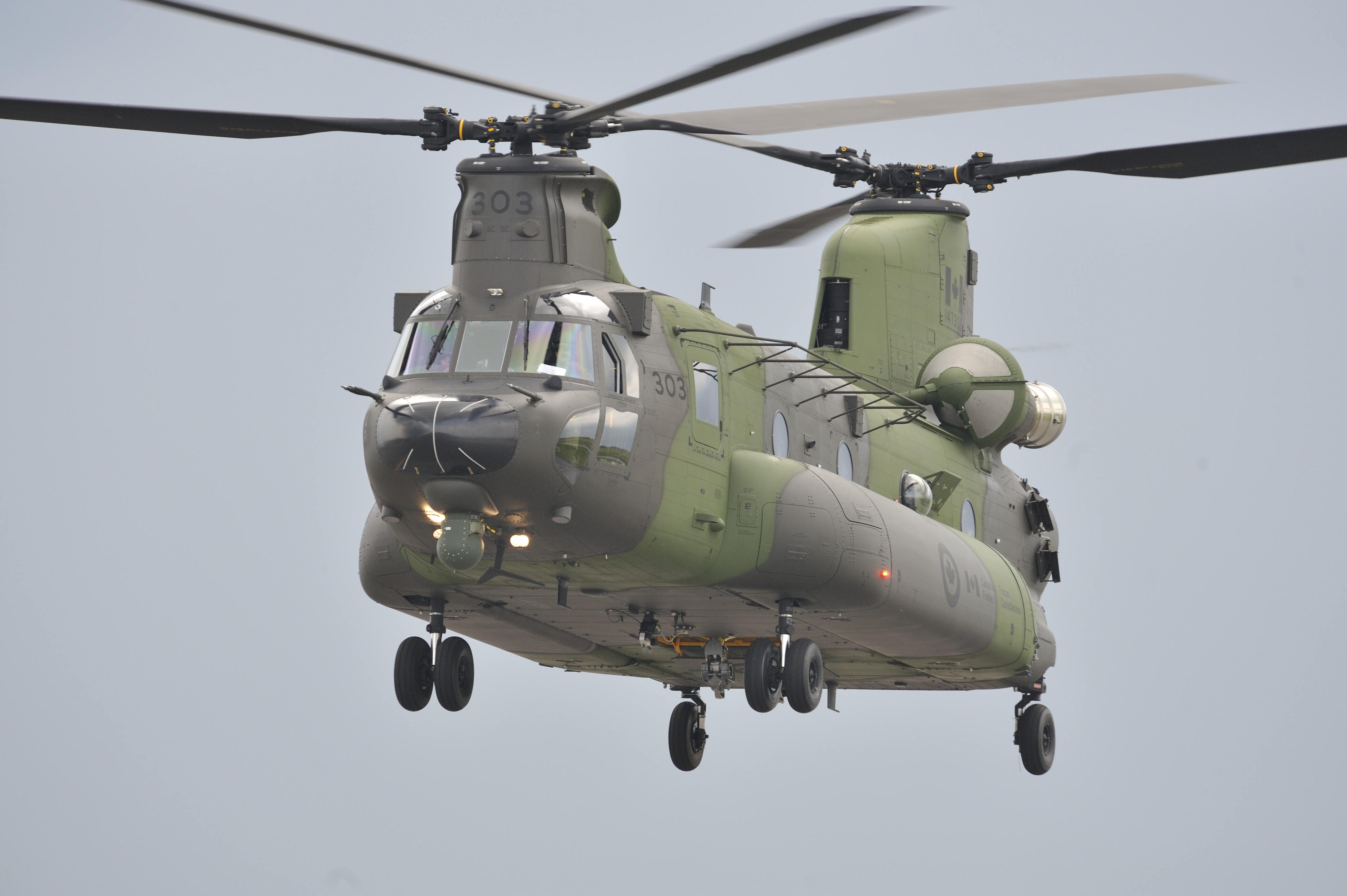 On June 26, 2013, direct from the Boeing plant in Philadelphia, Pennsylvania, Canada's new Chinook CH-147F medium- to heavy-lift helicopter prepares to set down at Ottawa International Airport. PHOTO: Ken Allan