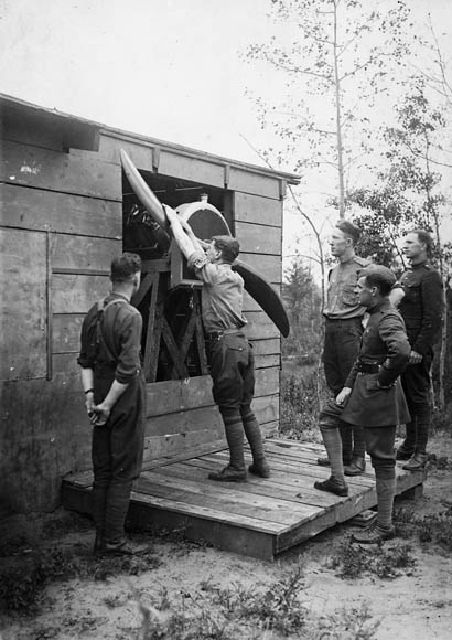 In a 1917 photograph, Royal Flying Corps Canada cadets learn how to swing-start an aircraft propeller at Camp Borden, Ontario. PHOTO: LAC MIKAN 3404143