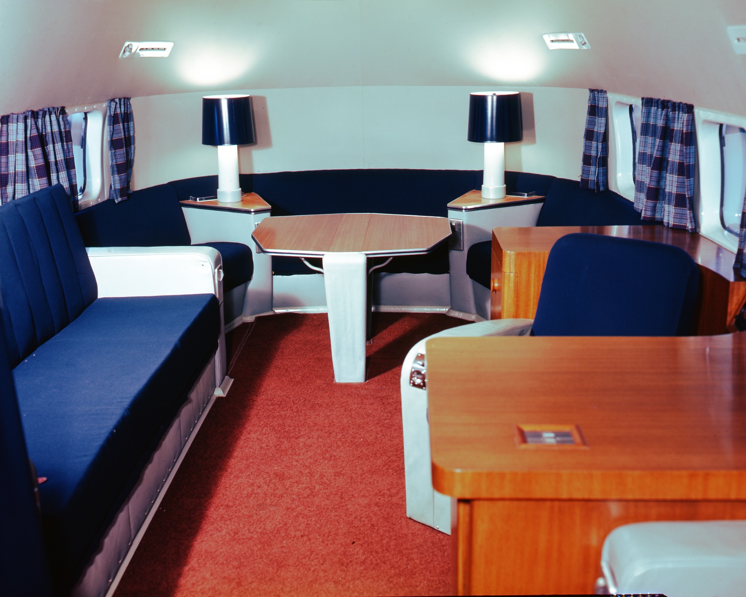 This aft cabin of a North Star conversion done by Canadair and delivered to Ottawa as the Royal Canadian Air Force’s premier VIP aircraft is decorated with typical 1950s-style furnishings and Royal Canadian Air Force tartan curtains. PHOTO: Canadair