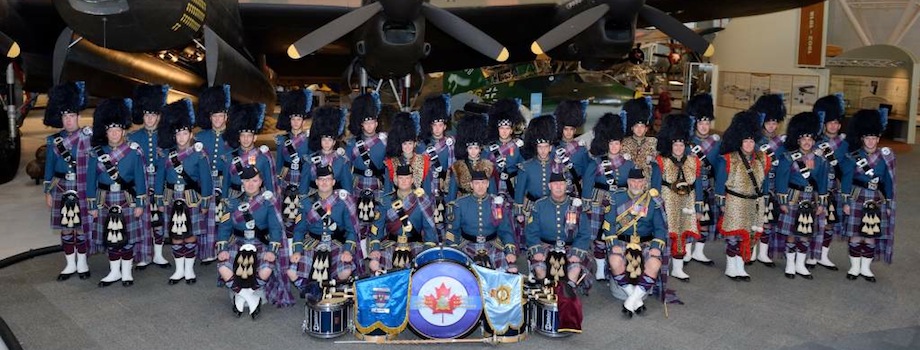 The Royal Canadian Air Force Pipes and Drums in full regalia including the Royal Canadian Air Force tartan gather in front of a Lancaster bomber on the display floor of the Canada Aviation and Space Museum in Ottawa, Ontario, in 2014. PHOTO: DND