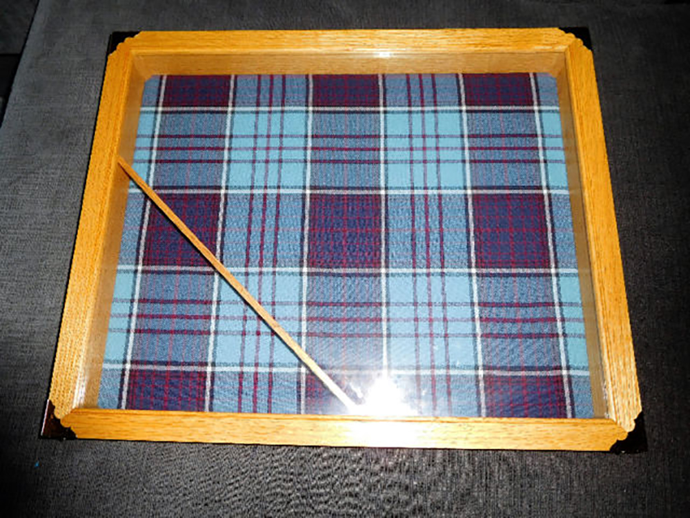 Craftspersons often incorporate the Royal Canadian Air Force tartan into their projects because its muted tones are very pleasing to the eye. IMAGE: http://www.kijiji.ca/v-buy-sell-other/dartmouth/rcaf-shadow-box/1247707887?enableSearchNavigationFlag=true