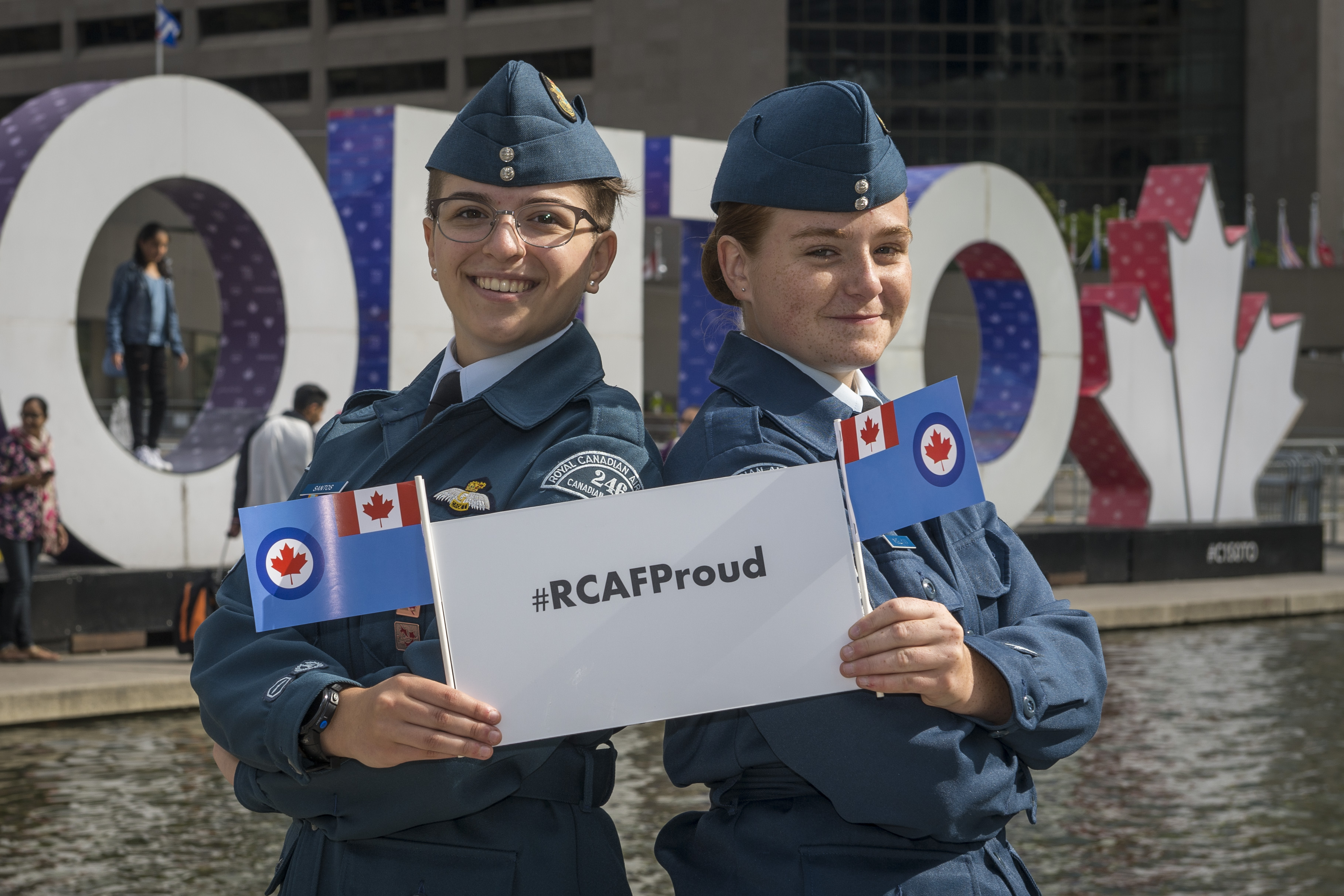 On August 31, 2017, Royal Canadian Air Force Cadets celebrate at the TORONTO sign at Nathan Phillips Square to mark the presentation of new Colours to the RCAF on September 1, also at Nathan Phillips Square. #RCAFProud PHOTO: Corporal Alana Morin, FA03-2017-0109-027