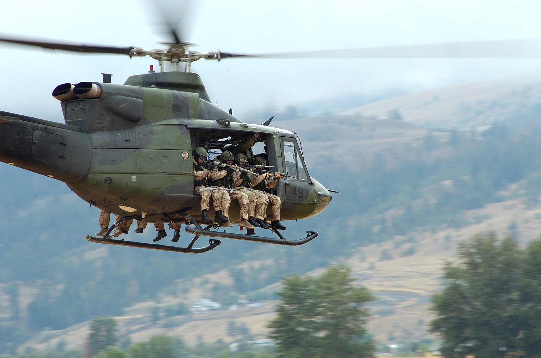 Troops from the Canadian Special Operations Regiment return to the forward operating base aboard a CH-146 Griffon helicopter from 427 Special Operations Aviation Squadron on July 20, 2006, during a training exercise near Kamloops, British Columbia. PHOTO: Sergeant Donald Clark, LW2006-5223d