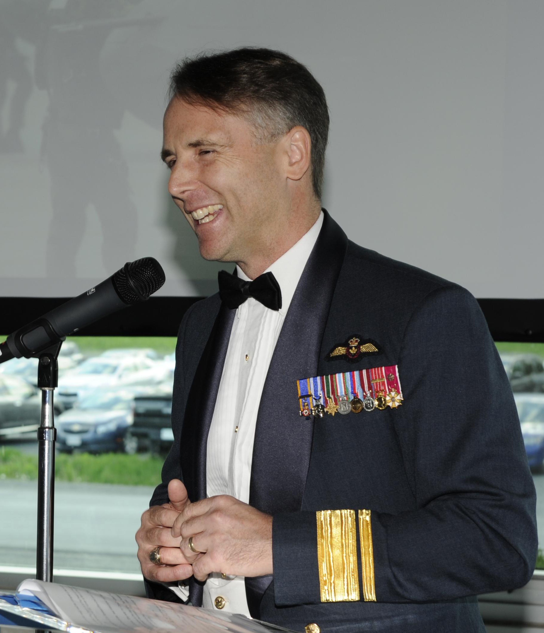 Major-General Meinzinger, deputy commander of the Royal Canadian Air Force and former commanding officer of 403 Helicopter Operational Training Squadron, addresses current and former “Wolfpack” members at the squadron’s 75th anniversary dinner, held May 27, 2016, in Gagetown, New Brunswick. On May 4, 2018, now-Lieutenant-General Meinzinger took command of the Royal Canadian Air Force. PHOTO: DND