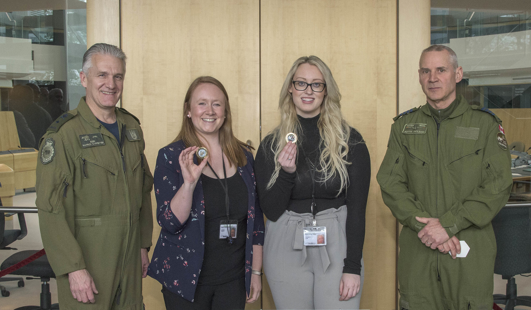 Jeanne Yurris (centre, left) and Savannah Lane, public affairs and communications interns, stand with Brigadier-General Patrick Carpentier (left) and Honorary Colonel Kevin McLeod after receiving Joint Task Force (North) coins during the honorary colonels conference hosted by Joint Task Force (North) on May 29, 2019, in Yellowknife, Northwest Territories. PHOTO: Captain Soomin Kim