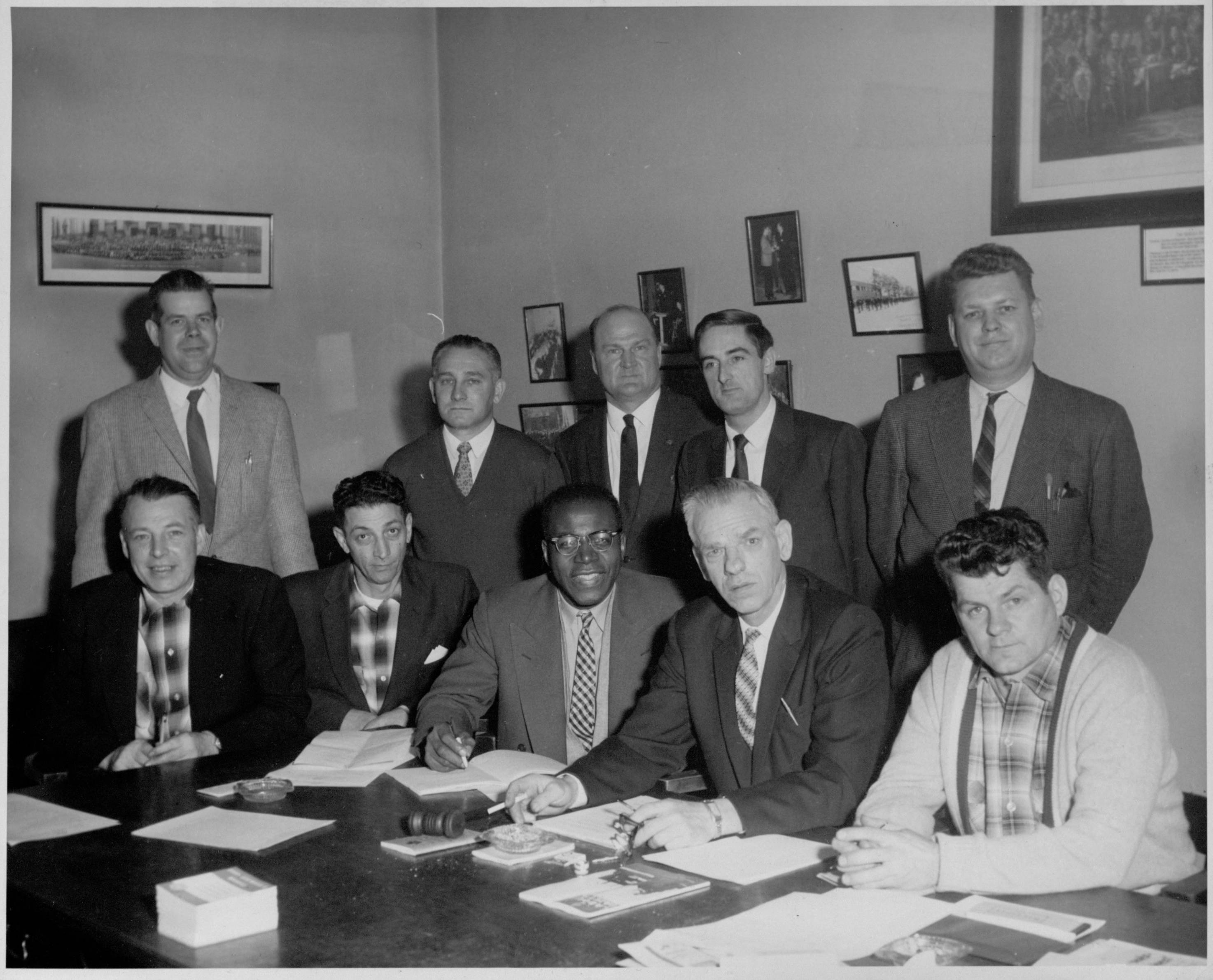 Henry Langdon and the executive committee of the International Association of Machinists Lodge 1751 in 1960. The Union became the International Association of Machinists and Aerospace Workers in 1965. Standing, left to right, are Tim Horst; L. Brosseur; B.T. Horan, general chairman of the l lodge; Mike Pitchford, shop chairman; and E. Davidson, financial secretary. Seated, left to right, are J. Comeau, trustee; R. Galazzo, trustee; Henry Langdon, recording secretary; Victor Rugenius, president; and E.D. Bowles, treasurer. PHOTO: L1985-13_018_019_029, International Association of Machinists and Aerospace Workers Photograph Collection, Southern Labor Archives. Special Collections and Archives, Georgia State University