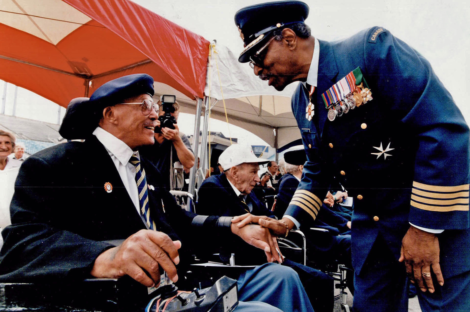Lieutenant Governor Lincoln Alexander, wearing the uniform of an honorary colonel of the Air Force, speaks with a veteran. PHOTO: Toronto Star Archives, tspa_0028978f
Lieutenant Governor Lincoln Alexander, wearing the uniform of an honorary colonel of the Air Force, speaks with a veteran. PHOTO: Toronto Star Archives, tspa-0028978f-adjusted