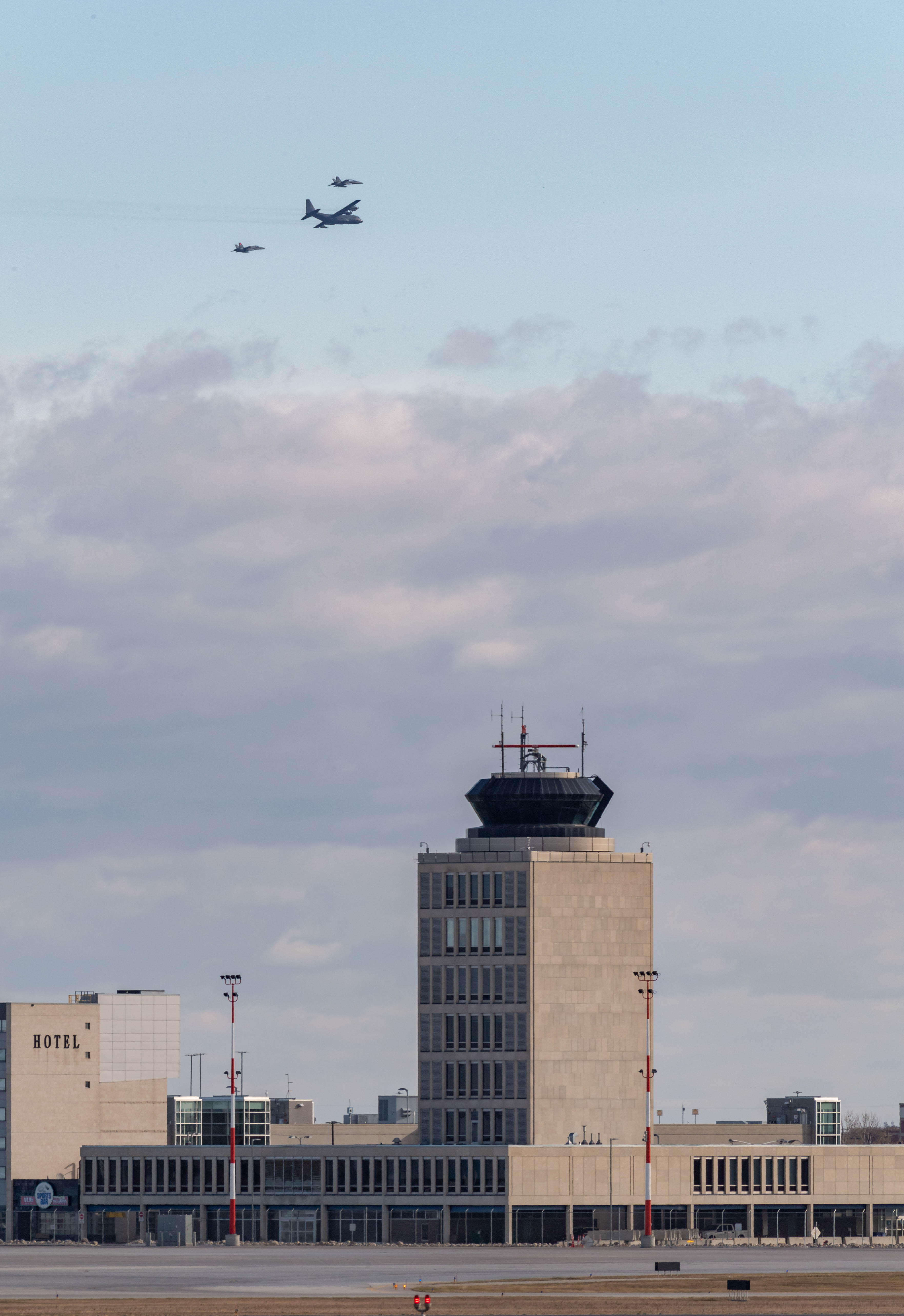 A CC-130 Hercules aircraft flies in formation with two CF-188 Hornet fighter aircraft over the Winnipeg on October 13, 2020, to mark the 60th year of service of the aircraft in the Royal Canadian Air Force. PHOTO: Corporal Darryl Hepner