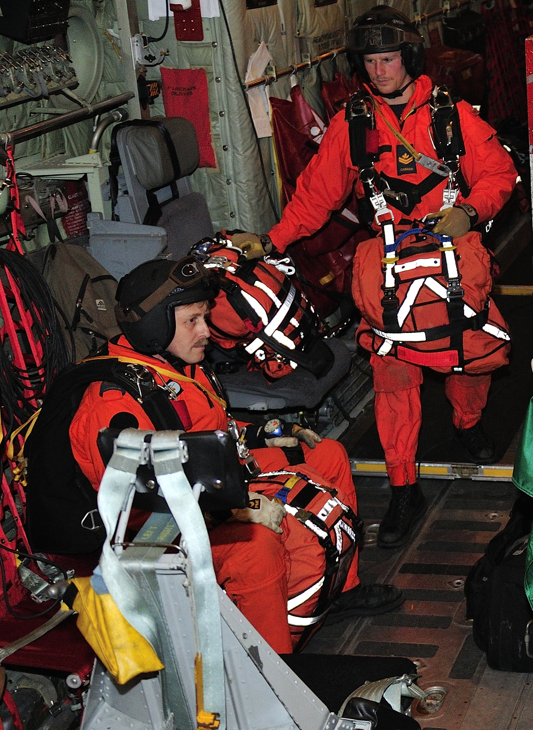 Sergeant André Hotton, seated in the rear of a CC-130 Hercules, prepares for the search and rescue training work ahead with squadron mates at 413 (Transport and Rescue) Squadron, 14 Wing Greenwood, in 2014. PHOTO: 14 Wing