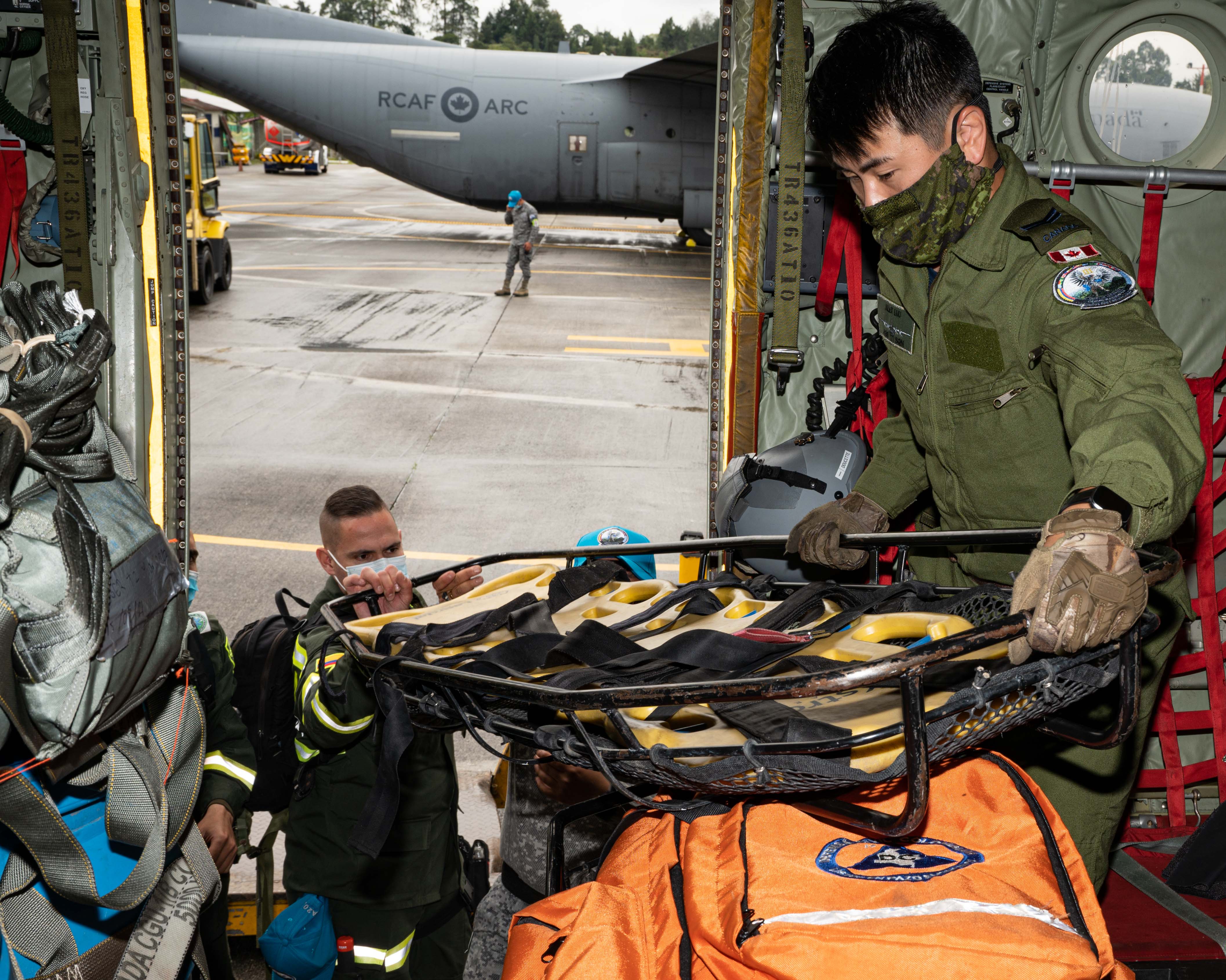 Corporal Alex Luu loads rescue equipment inside a CC-130 Hercules at Arturo Lema Posada Air Base in Colombia during Exercise COOPERACION VII on 31 August 2021. PHOTO: Corporal Dominic Duchesne-Beaulieu