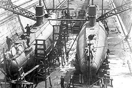His Majesty’s Canadian Ship CH-14 and CH-15 in dry dock in Halifax, circa 1920. In late 1919, Her Majesty’s Submarines H-14 and H-15 arrived in Halifax from the Royal Navy. They were fully refitted at the Halifax Shipyard and were commissioned into the Royal Canadian Navy in April 1921.