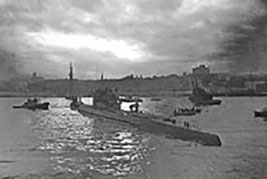 German Navy Submarine, U-190 arrives in St. John’s Newfoundland in June 1945 after surrendering to Royal Canadian Navy sailors off the coast of Newfoundland on 12 May 1945. It was almost immediately commissioned into the Royal Canadian Navy as His Majesty's Canadian Ship U-190 for testing and evaluations.