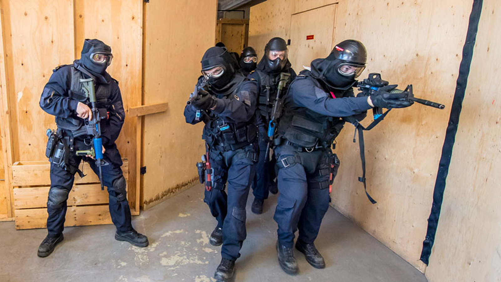 Slide - Naval Boarding Party candidates conduct Simunition Close Quarter Battle training.