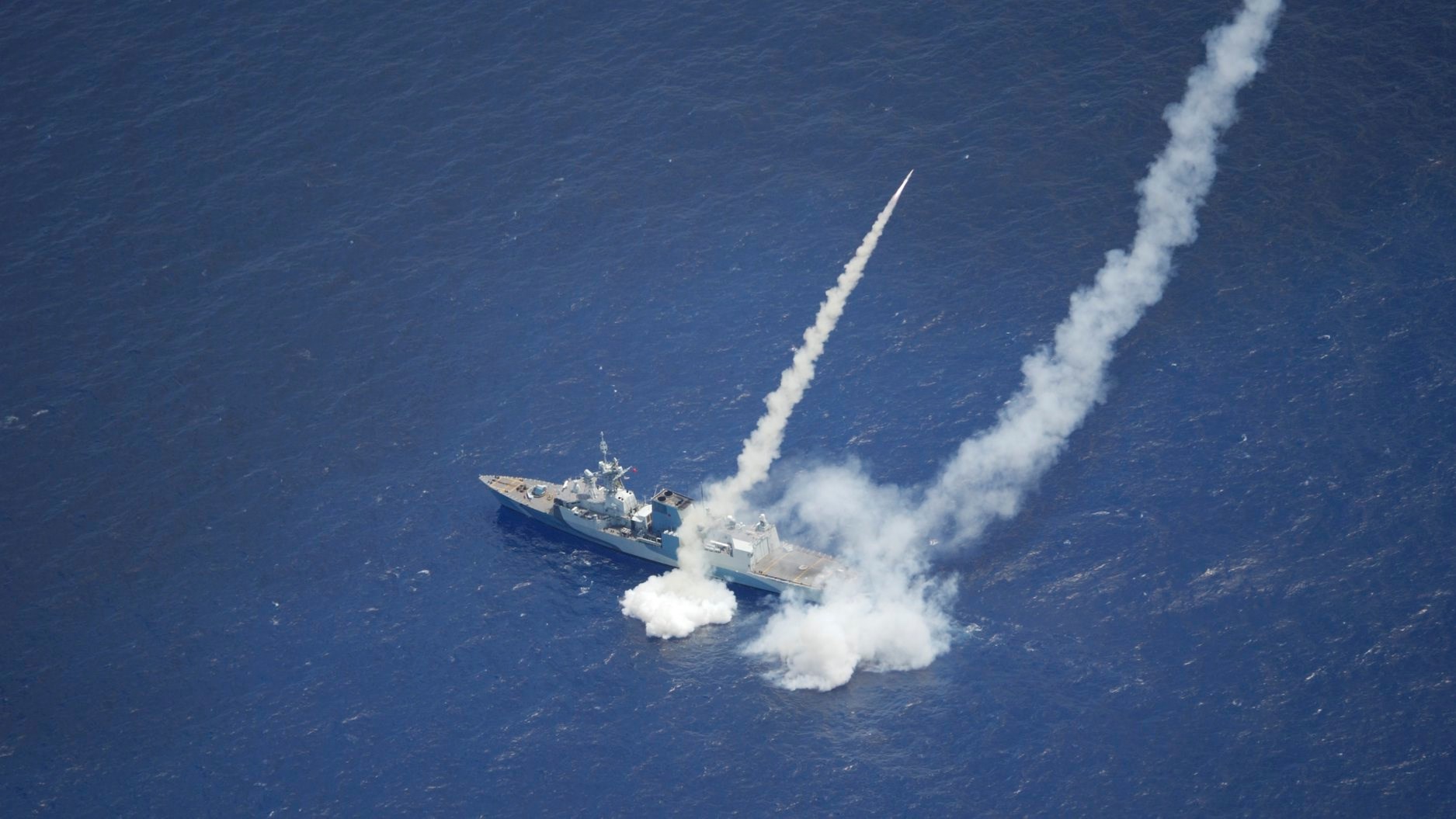 HMCS Regina fires two RGM-84 Harpoon Surface-to-Surface Missiles