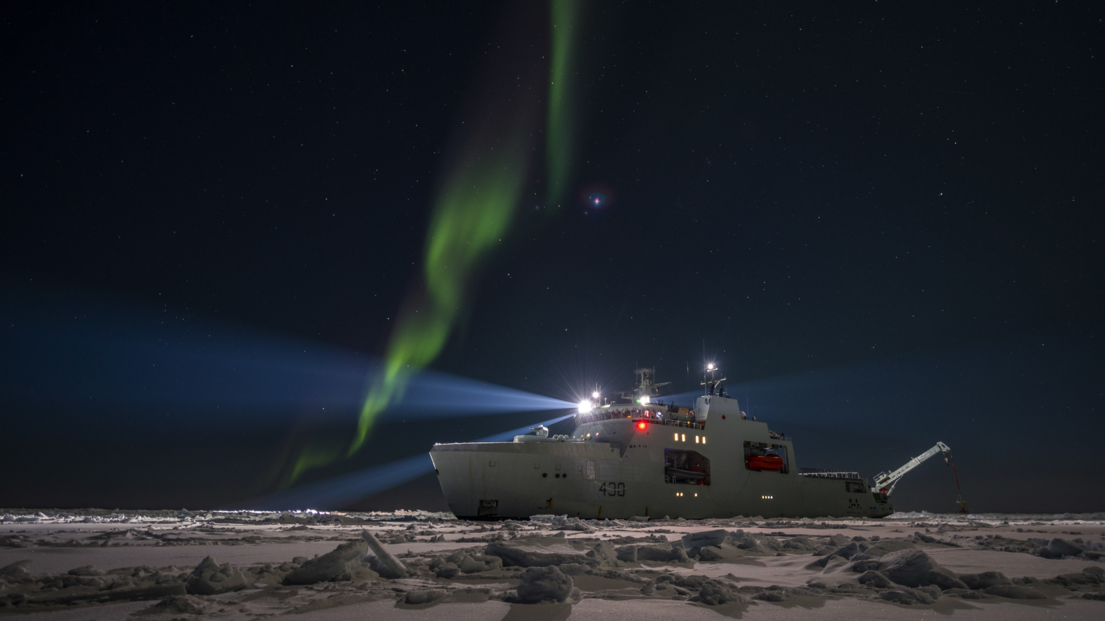 Northern lights flare above HMCS Harry DeWolf