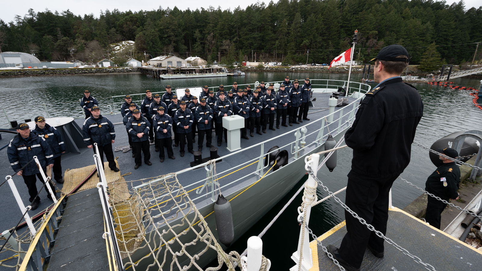Commodore Angus Topshee addresses the sailors of HMCS Saskatoon