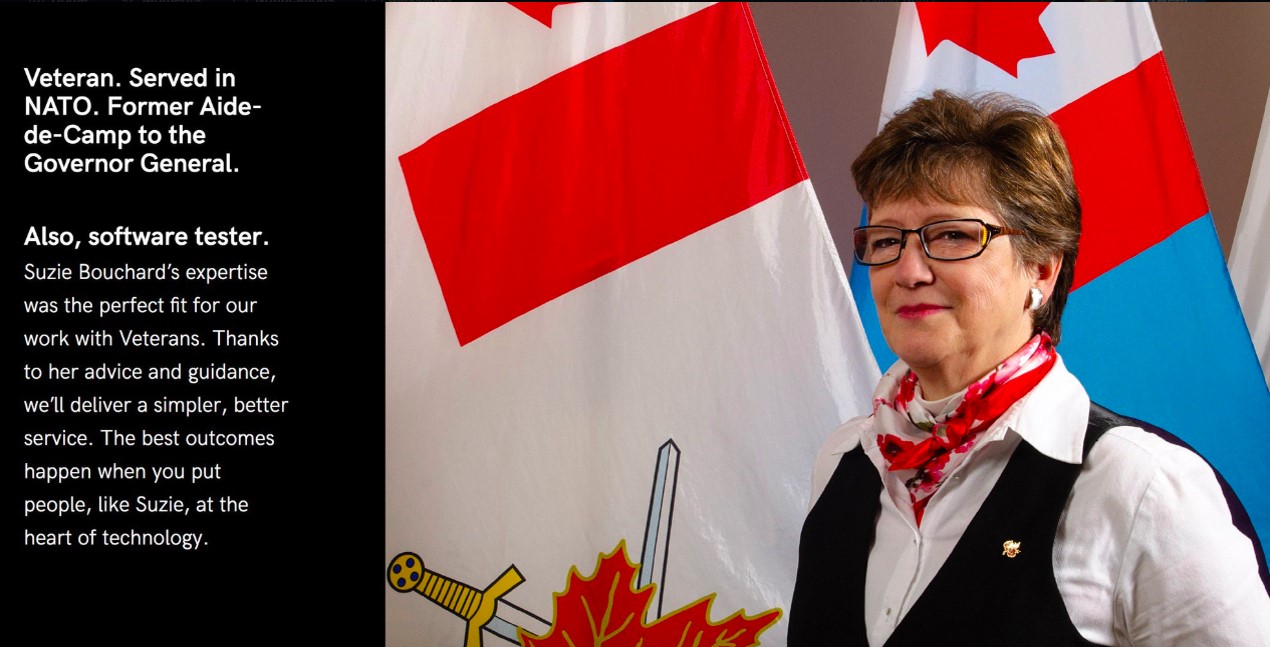 A photograph of Suzie, a veteran, standing in front of Canadian military flags. Text version below: