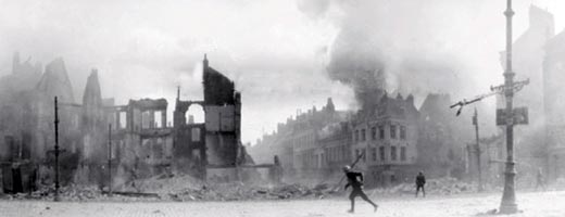 A soldier runs across the ruins of a devastated city during the First World War