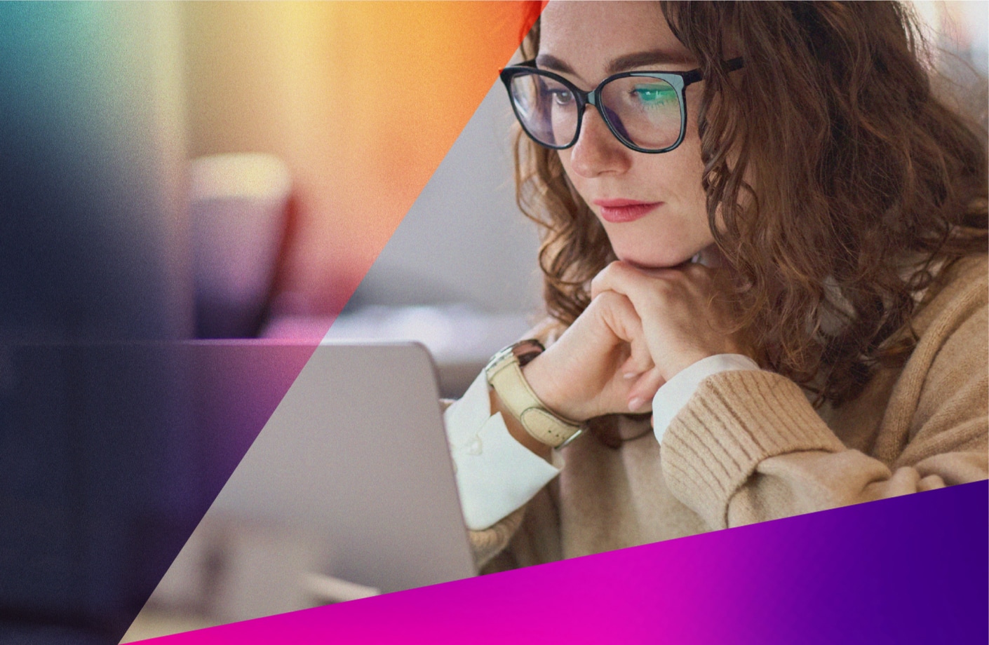 A woman with curly hair and glasses, resting her chin on her hands while focused on a laptop screen, with colorful geometric shapes overlaid on the image.