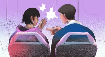 A man and a woman sitting on a bus, with the woman visibly upset and gesturing toward the man during an argument.