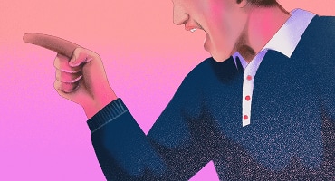 A close-up of a man pointing his finger aggressively.