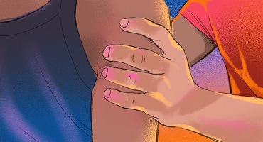 A close-up of a man's hand grabbing a woman's shoulder.